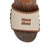 Canvas and leather clogs