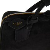 Le Teckel suede clutch bag