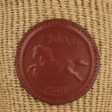 Embossed leather-trimmed faux raffia bucket bag