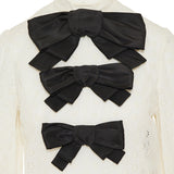 Bow-embellished broderie anglaise cotton blouse
