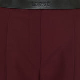Leather‑trimmed pleated wool flared trousers
