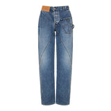 Twisted asymmetric embroidered high‑rise jeans