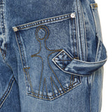 Twisted asymmetric embroidered high‑rise jeans