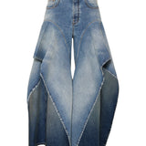 Alaïa Ruffle-hem denim jeans