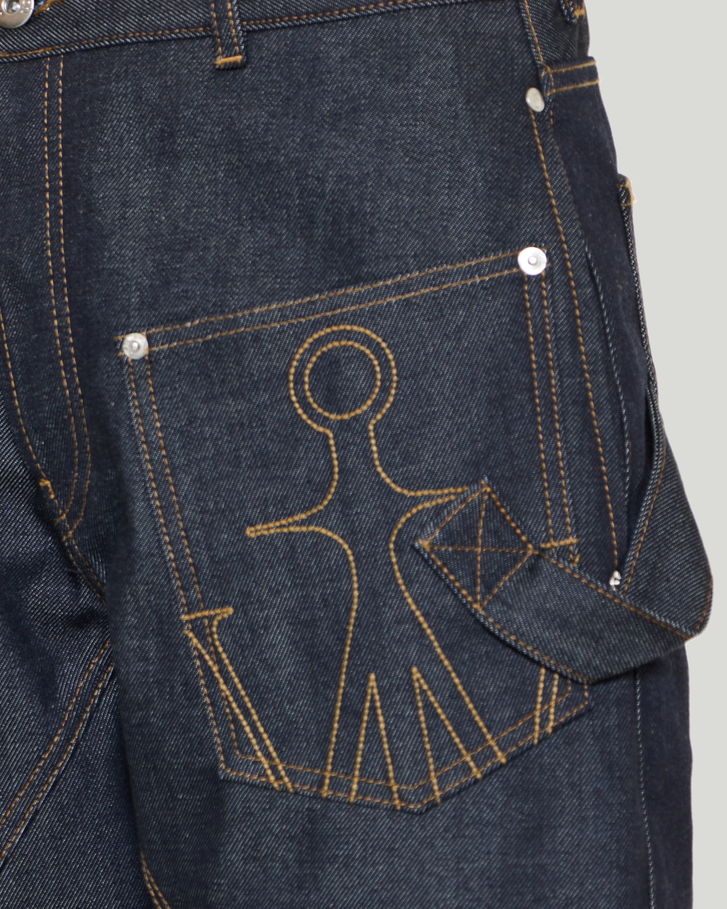 JW Anderson Twisted asymmetric embroidered high-rise jeans – Luisa