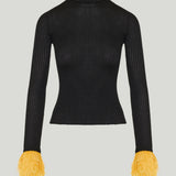 La DoubleJ Feather-trimmed ribbed turtleneck top