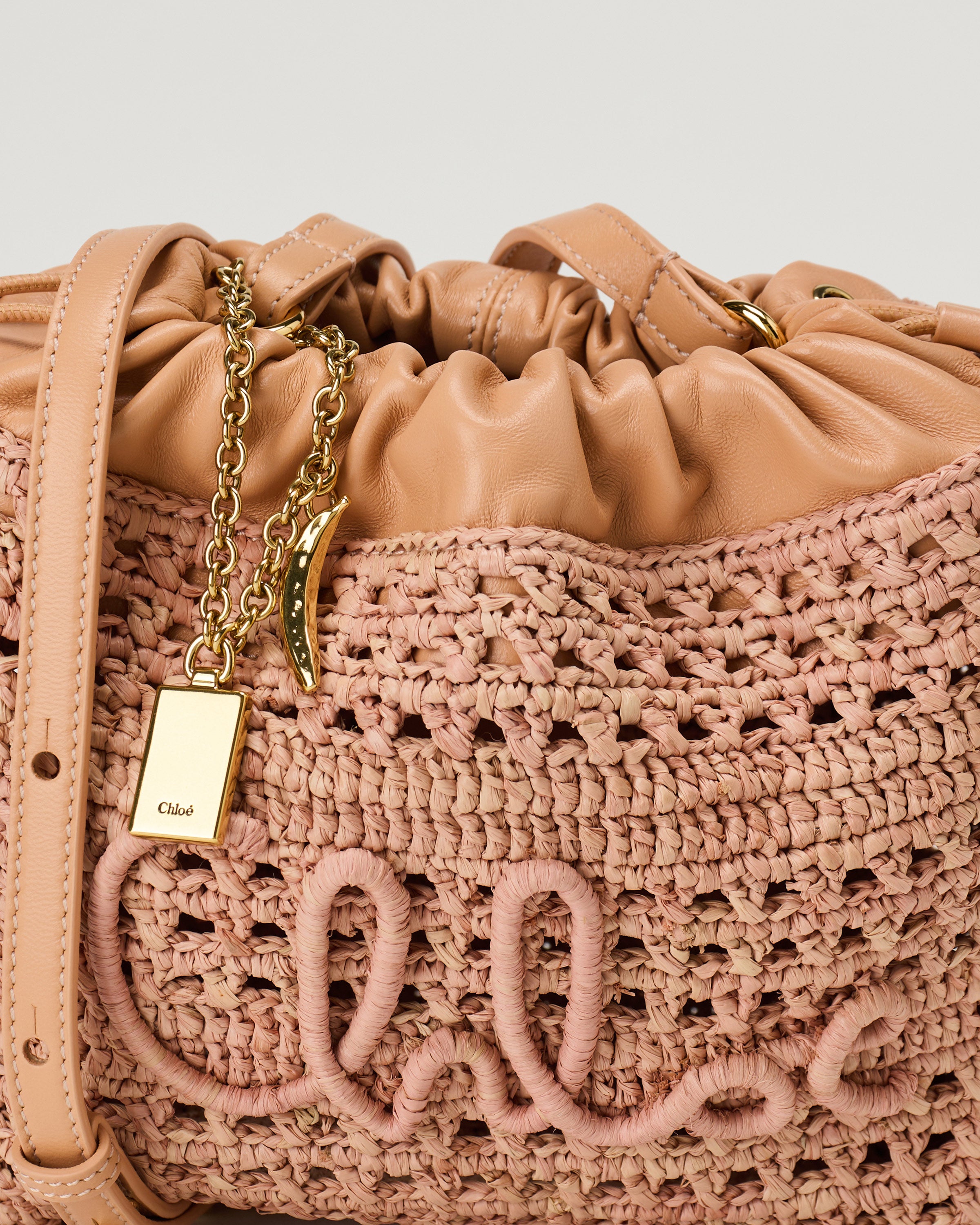 Chloé Mini Summer Banana drawstring shoulder bag in raffia | Luisa