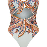 Zimmermann Aster strapless knot-detailed cut-out printed swimsuit